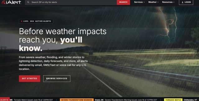 The redesigned iAlert.com homepage showing the new interface, live alerts, top stories, and weather analysis tools