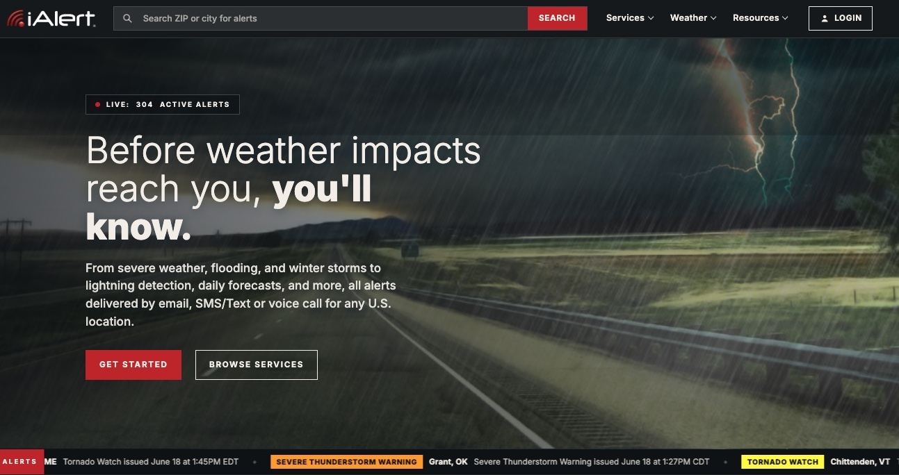 The redesigned iAlert.com homepage showing the new interface, live alerts, top stories, and weather analysis tools